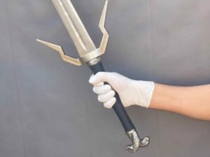 Person displaying Witcher Silver Sword Replica in hand to demonstrate size and weight proportion